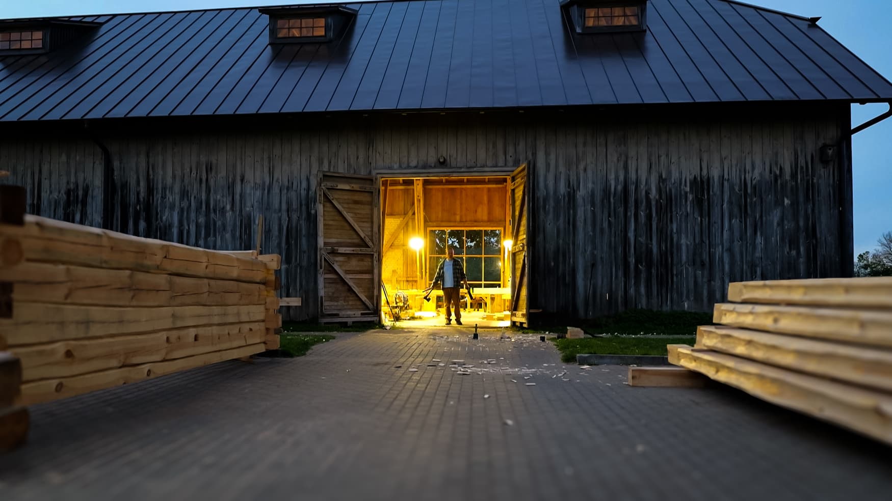 Traditional timber frame barn in Latvia at dusk